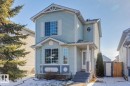 Light blue siding exterior with white trim and a covered front porch - 15043 132 Street, Edmonton, AB  - Outdoor 
