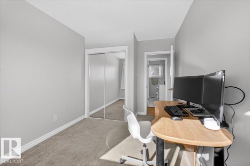 Neutral-toned interior room featuring carpeted flooring and white baseboards - 13508 81 Street, Edmonton, AB - Indoor Photo Showing Office