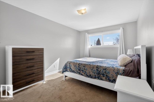 Bedroom featuring light gray walls and recessed window with white trim - 13508 81 Street, Edmonton, AB - Indoor Photo Showing Bedroom