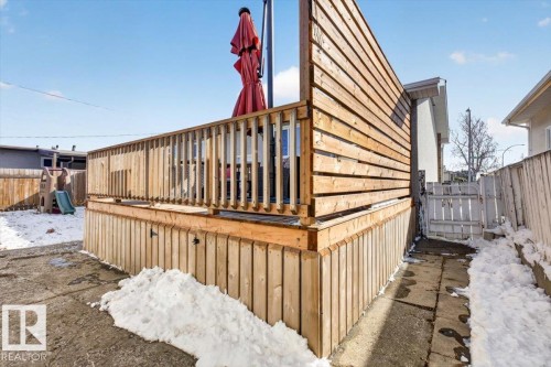 Expansive wood deck featuring vertical slatted railings and a horizontal slatted privacy screen - 13508 81 Street, Edmonton, AB - Outdoor