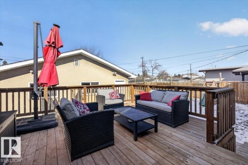 Expansive wooden deck featuring sturdy railings and a clear sky backdrop - 13508 81 Street, Edmonton, AB - Outdoor With Deck Patio Veranda With Exterior