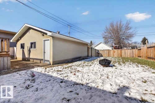 Detached stucco garage with a single entry door and two windows - 13508 81 Street, Edmonton, AB - Outdoor