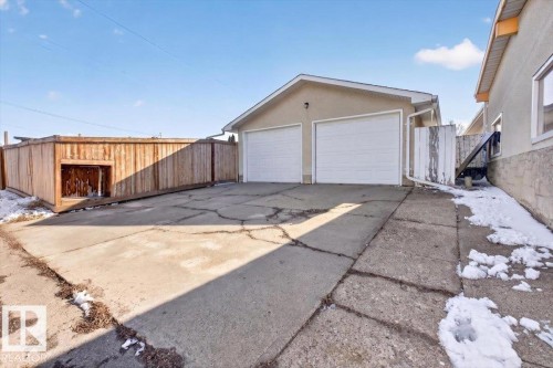 Attached two-car garage with white overhead doors - 13508 81 Street, Edmonton, AB - Outdoor