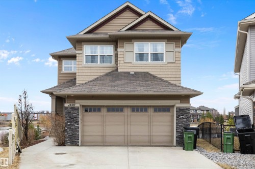 Two-story residence featuring tan horizontal siding and shake accents - 1586 Chapman Way, Edmonton, AB - Outdoor With Facade