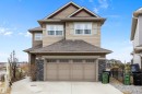Two-story residence featuring tan horizontal siding and shake accents - 1586 Chapman Way, Edmonton, AB  - Outdoor With Facade 