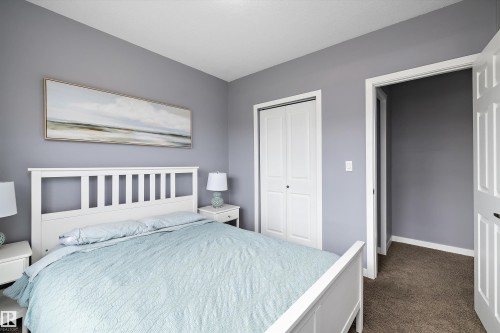 Bedroom featuring neutral gray walls, white baseboards, and carpeted flooring - 1586 Chapman Way, Edmonton, AB - Indoor Photo Showing Bedroom