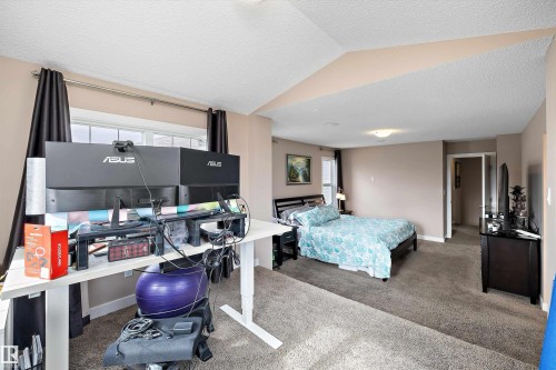 Carpeted sleeping area with neutral wall tones and a window - 1586 Chapman Way, Edmonton, AB - Indoor Photo Showing Bedroom