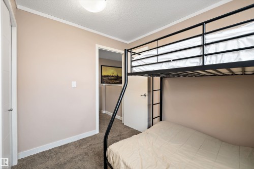 Neutral-toned interior with carpeted flooring and white trim - 1586 Chapman Way, Edmonton, AB - Indoor Photo Showing Bedroom