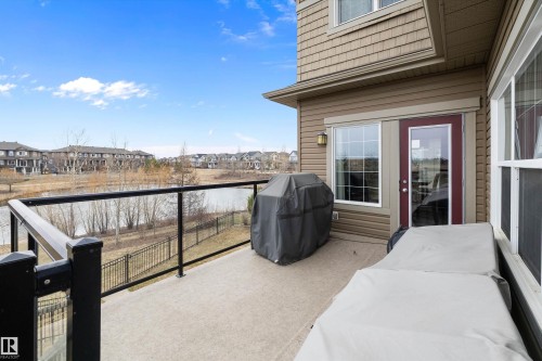 Outdoor deck featuring a glass railing system and water scenery - 1586 Chapman Way, Edmonton, AB - Outdoor With Exterior
