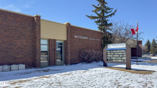 Brick exterior with light-colored siding accents and multiple large windows - 5303 21 Avenue, Edmonton, AB - Outdoor