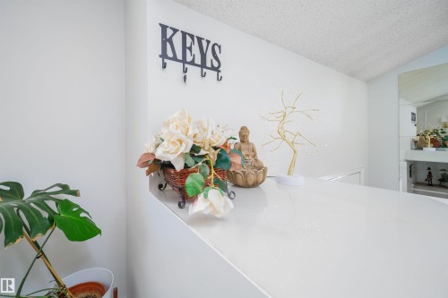 Crisp white wall finishes and a textured ceiling - 5303 21 Avenue, Edmonton, AB - Indoor Photo Showing Other Room