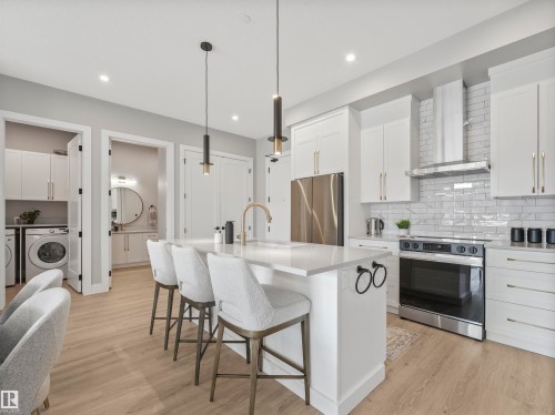 101 7471 May Common, Edmonton, AB - Indoor Photo Showing Kitchen With Stainless Steel Kitchen With Upgraded Kitchen