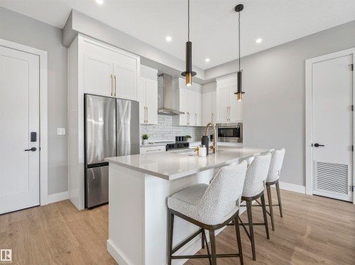 101 7471 May Common, Edmonton, AB - Indoor Photo Showing Kitchen With Stainless Steel Kitchen With Upgraded Kitchen