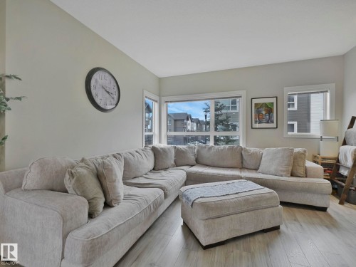 124 2560 Pegasus Boulevard, Edmonton, AB - Indoor Photo Showing Living Room