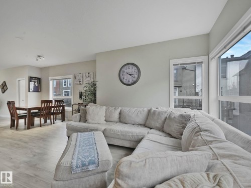 124 2560 Pegasus Boulevard, Edmonton, AB - Indoor Photo Showing Living Room