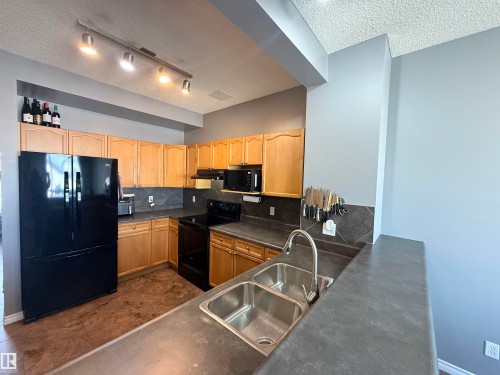 73 Birchmont Drive, Leduc, AB - Indoor Photo Showing Kitchen With Double Sink