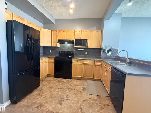 73 Birchmont Drive, Leduc, AB - Indoor Photo Showing Kitchen With Double Sink