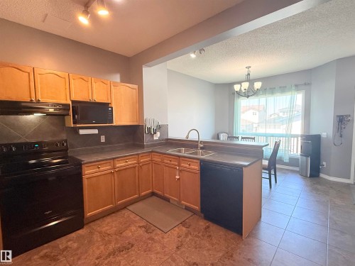 73 Birchmont Drive, Leduc, AB - Indoor Photo Showing Kitchen With Double Sink