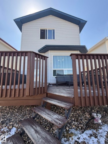 Expansive wooden deck featuring perimeter railing and multi-level steps - 73 Birchmont Drive, Leduc, AB - Outdoor With Exterior