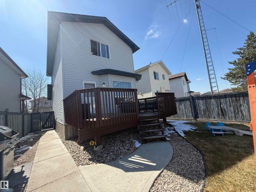 Rear exterior featuring siding, bay window, and a wood deck with railings - 73 Birchmont Drive, Leduc, AB - Outdoor With Deck Patio Veranda With Exterior