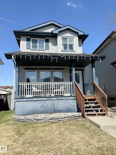 Two-story residence featuring light gray siding with contrasting dark trim - 73 Birchmont Drive, Leduc, AB - Outdoor With Deck Patio Veranda