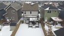 Fenced backyard featuring a wooden deck, covered patio area, and storage shed - 3609 Weidle Bend Bend, Edmonton, AB  - Outdoor 