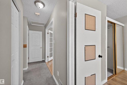 Hallway featuring light gray wall paint, recessed ceiling light fixture, and gray carpet flooring - 11 Greenfield Estates, St. Albert, AB - Indoor Photo Showing Other Room