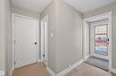Entryway featuring wood-finish flooring, light grey painted walls, and white trim - 11 Greenfield Estates, St. Albert, AB  - Indoor Photo Showing Other Room 