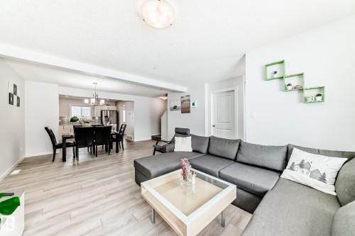 Open-concept living space featuring wood-finish flooring, recessed lighting, and a bright white paint palette - 2505 14 Avenue, Edmonton, AB - Indoor Photo Showing Living Room