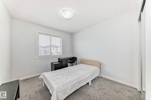 Neutral wall paint and carpeting throughout - 2505 14 Avenue, Edmonton, AB - Indoor Photo Showing Bedroom