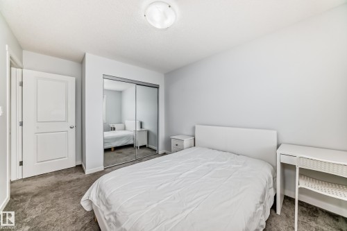 Bedroom featuring neutral gray carpeting and light gray wall paint - 2505 14 Avenue, Edmonton, AB - Indoor Photo Showing Bedroom