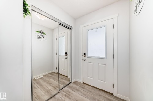 Entryway featuring wood-finish flooring and light gray walls - 2505 14 Avenue, Edmonton, AB - Indoor Photo Showing Other Room