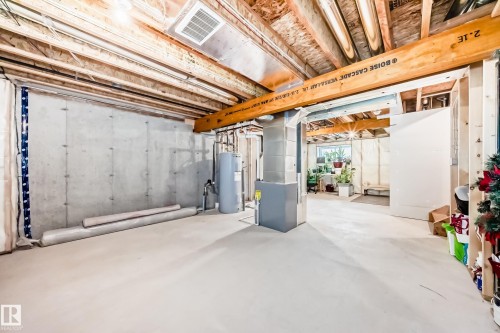Unfinished basement offering ample space with concrete flooring - 2505 14 Avenue, Edmonton, AB - Indoor Photo Showing Basement