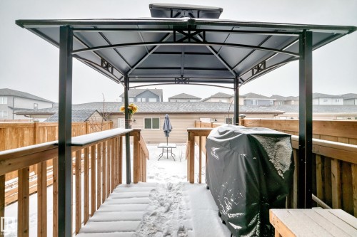 Covered outdoor deck area featuring a metal gazebo structure - 2505 14 Avenue, Edmonton, AB - Outdoor With Exterior
