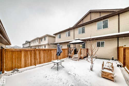 Private backyard featuring a wooden fence, wood deck with a gazebo, and a raised planter - 2505 14 Avenue, Edmonton, AB - Outdoor With Exterior