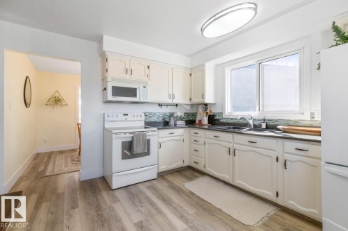 6908 19 Avenue, Edmonton, AB - Indoor Photo Showing Kitchen With Double Sink