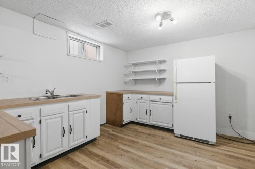 6908 19 Avenue, Edmonton, AB - Indoor Photo Showing Kitchen With Double Sink