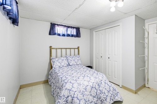 Interior room featuring light gray walls, a drop ceiling, and light-toned flooring - 3920 35A Avenue, Red Deer, AB - Indoor Photo Showing Bedroom