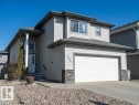 Modern two-story home featuring light grey siding and dark grey trim accents - 5701 Rue Eaglemont, Beaumont, AB  - Outdoor 