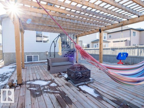 Expansive wooden deck featuring a slatted pergola structure - 5701 Rue Eaglemont, Beaumont, AB - Outdoor With Deck Patio Veranda