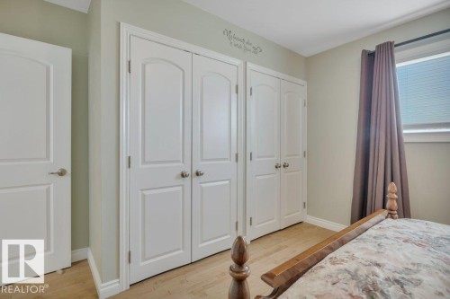 Recessed panel doors with brushed nickel hardware - 10633 St Gabriel School Road, Edmonton, AB - Indoor Photo Showing Bedroom