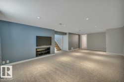 Spacious room featuring neutral carpeting and recessed lighting - 