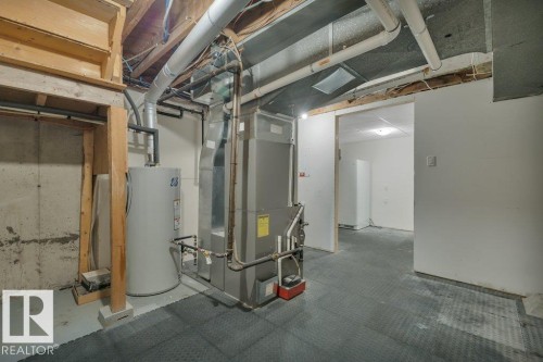 Utility area featuring a water heater and HVAC system - 10633 St Gabriel School Road, Edmonton, AB - Indoor Photo Showing Basement