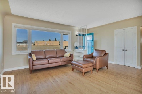 Expansive window offering abundant natural light - 10633 St Gabriel School Road, Edmonton, AB - Indoor Photo Showing Living Room
