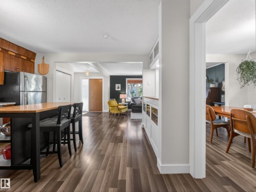 Spacious kitchen island with butcher block countertop and integrated storage - 11345 89 Street, Edmonton, AB - Indoor