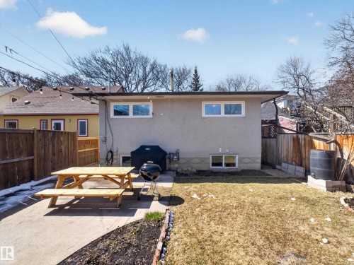 Private backyard featuring a concrete patio, fenced perimeter, and a grass area - 11345 89 Street, Edmonton, AB - Outdoor With Deck Patio Veranda