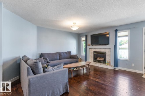 16056 84 Street Nw, Edmonton, AB - Indoor Photo Showing Living Room With Fireplace