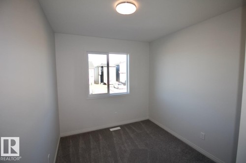 Upper 3716 42 Avenue, Beaumont, AB - Indoor Photo Showing Other Room