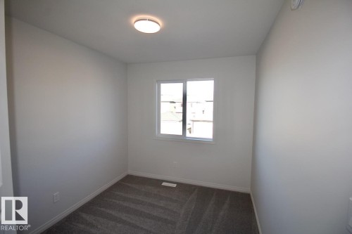 Upper 3716 42 Avenue, Beaumont, AB - Indoor Photo Showing Other Room