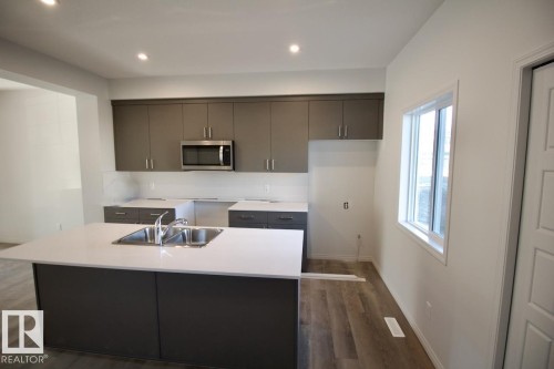 Upper 3716 42 Avenue, Beaumont, AB - Indoor Photo Showing Kitchen With Double Sink